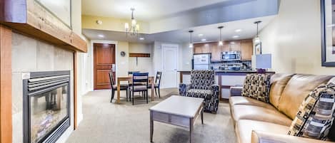 Living area - Brand new Queen sofa sleeper, gas fireplace, ceiling fan, and access to the private balcony.