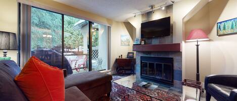 Living area with woodburning fireplace