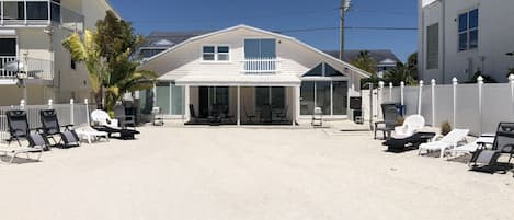 Back yard onto beach of Duplex,  North side is on left in picture.