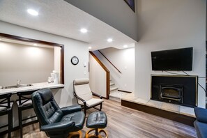 Living room with cozy wood burning fireplace