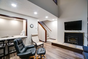 Living room with cozy wood burning fireplace