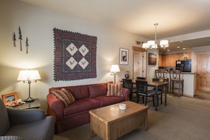 Open living room into kitchen.