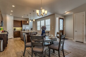 6 person dining table open to kitchen area