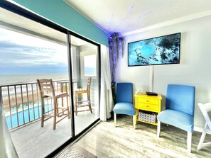 Did we mention views!  The living space includes a 50” Roku TV, a pull out full sofa, dinning table, & full kitchen