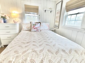 Full size bed with down comforter and high end pillows. No closet. 