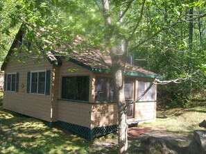 Front of cottage showing the screened in porch