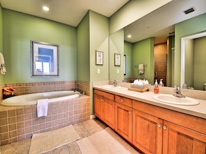 Spacious master bathroom has large vanity with his and her's sinks