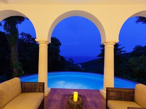 Twilight when the infinity edge pool fades into the sea and the sky...