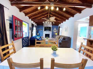 Dining and living room has easy access to private back patio with seating for 6 or more.