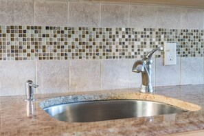 Granite and glass countertop in kitchen 