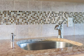 Granite and glass countertop in kitchen