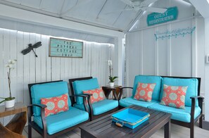 Tastefully decorated, shaded outdoor lounge area.