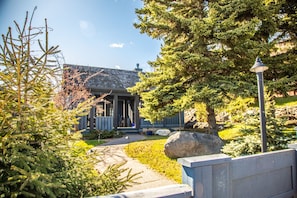 Grand Marais House of Light has large windows that allow in natural light while the foliage and fencing surrounding the home provide solitude and privacy.