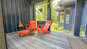 Relax on the front porch of the home.