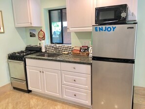 Full kitchen with stove and fridge, all utensils, coffee pot, toaster.