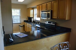 Kitchen upgraded stainless steel appliances, granite counter tops