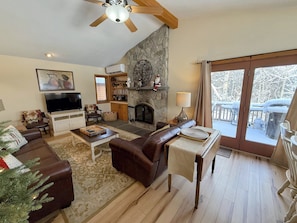 Dining/Living Area: Open concept space offers dining table with room for 8 and comfortable couches to relax by the stone fireplace. TV with high speed wi-fi included.