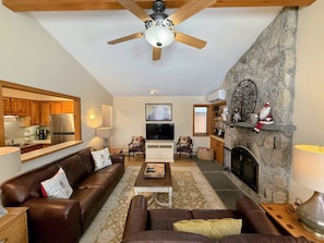 Dining/Living Area: Open concept space offers dining table with room for 8 and comfortable couches to relax by the stone fireplace. TV with high speed wi-fi included.