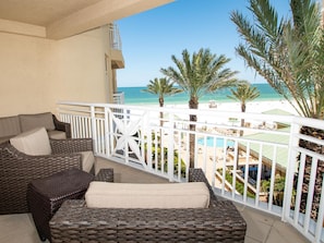 Observe the beautiful pool and beach right from the comfort of your balcony