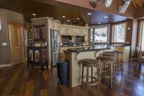Well stocked open kitchen.