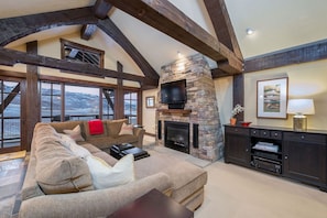 Large Living area with timbers and gas fireplace