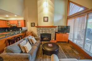 Living area with fireplace and TV