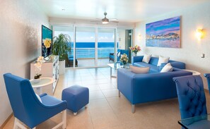 Oceanfront living space with 85" smart TV.