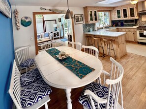 Newly Remodeled Open Concept Kitchen flowing into Cathedral Ceiling Sunroom. 