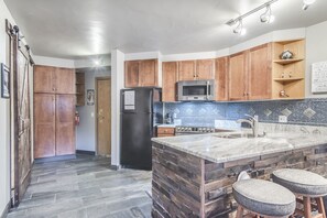 Kitchen - Beautifully upgraded counters, floor, and fixtures.