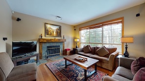 Living area with TV and fireplace