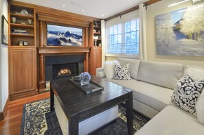 living area with TV and fireplace