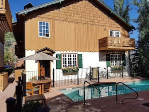 Frontal view of Alpenblick #4 showing the semi-private pool, Jacuzzi and grill.