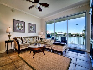 Spacious living room has access to the balcony.