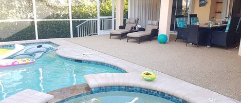 inviting Patio with heated pool and user friendly Jacuzzi