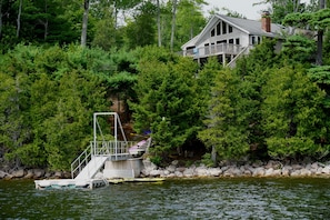 The dock and vacation home viewed from the lake