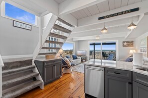 View from kitchen towards family room and ocean views! 