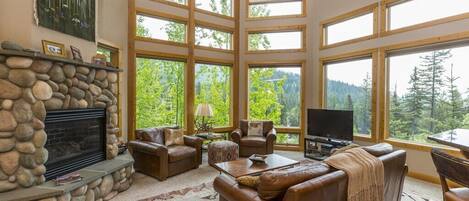 Living room with big windows offering a great view!