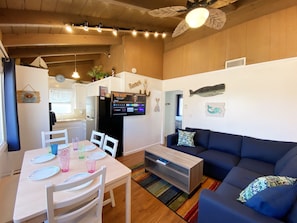 Living room with A/C a peek a boo view of the bay and 43" Smart Fire TV!