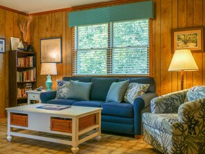 Living Area with Sleeper Sofa, TVDVD, and Screened Porch Access