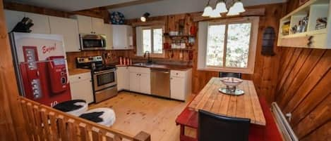 Kitchen w/ handmade table and copper countertops