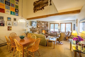 Beautiful living room with large wood burning fireplace