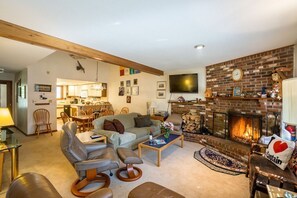 Open, spacious living room, plenty of seating for family and guests.  Enjoy the fireplace during your stay.
