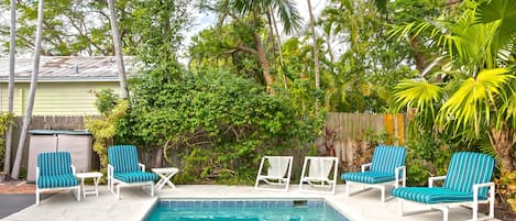 Pool features lush tropical surroundings for extra privacy.