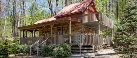 Large wrap around covered porch and private  upper deck off bedroom.