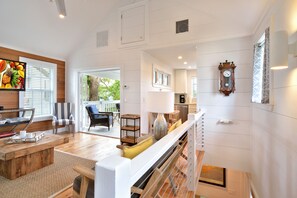 Stairs leading up to living area and outdoor balcony.