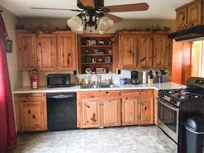 Full equipped kitchen. Dishwasher, stove, and full size fridge. Pots & pans too!