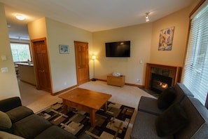 Living room with fireplace and sofabed