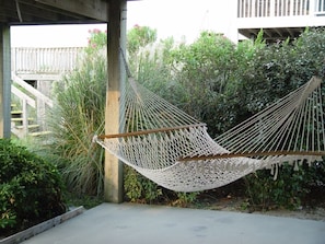 Hammock next to enclosed outdoor shower