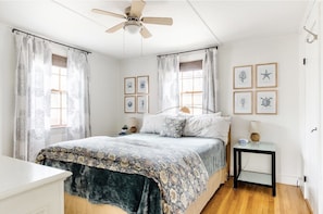 1st floor bedroom with queen size bed & flat screen TV.