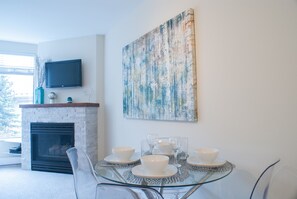 Living and dining area with fireplace